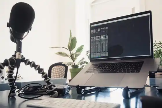 Podcast microphone and mixing desk in a studio with a price negotiation in progress